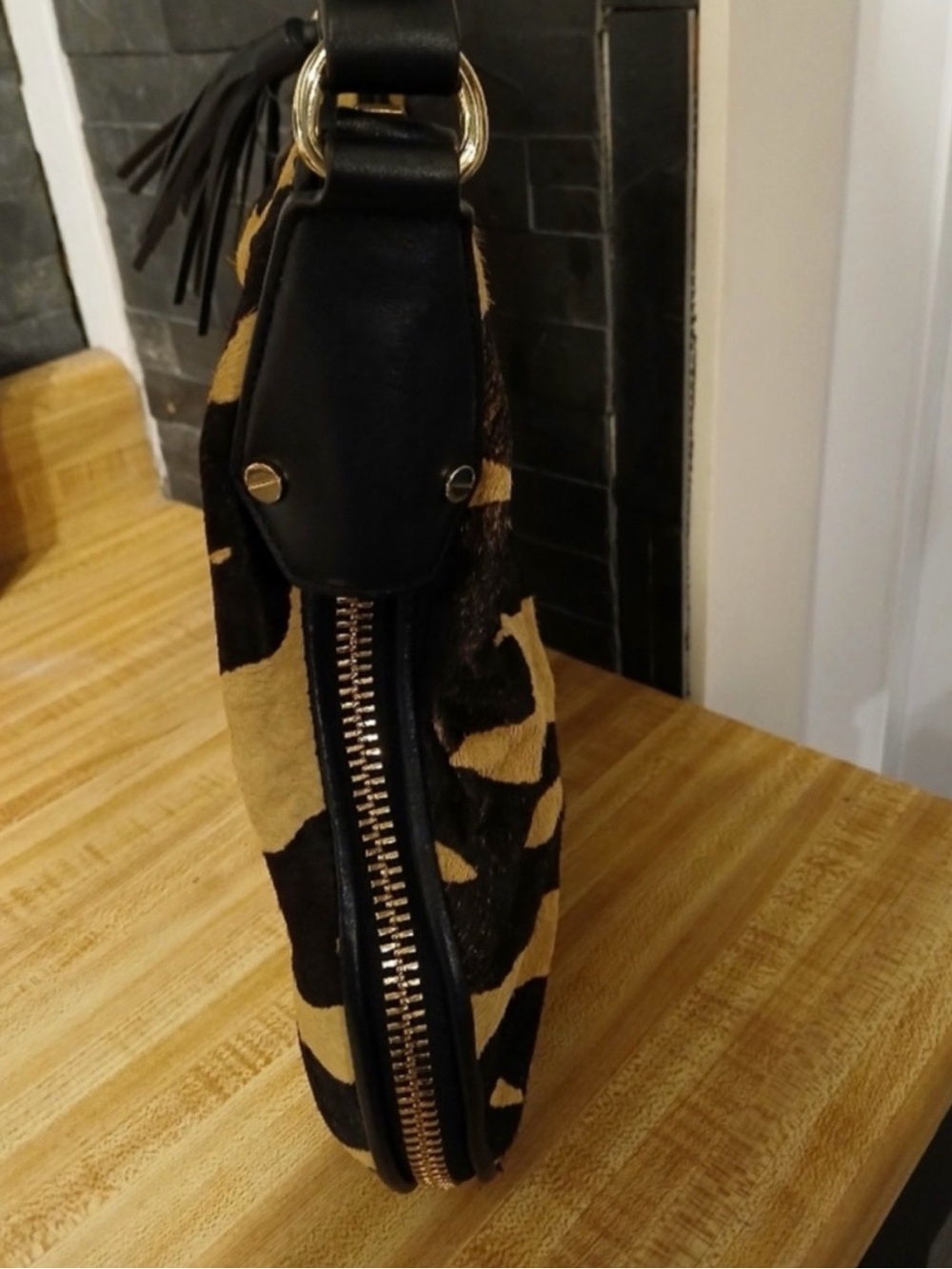 Henri Bendel- Black and Tan Animal-Print Calf Hair Shoulder Bag with Tassel - Picture 4 of 7